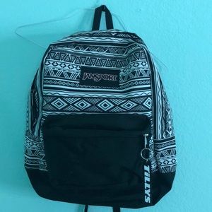 black and white jansport backpack